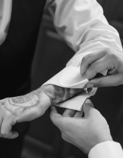 Groom is getting dressed before the ceremony