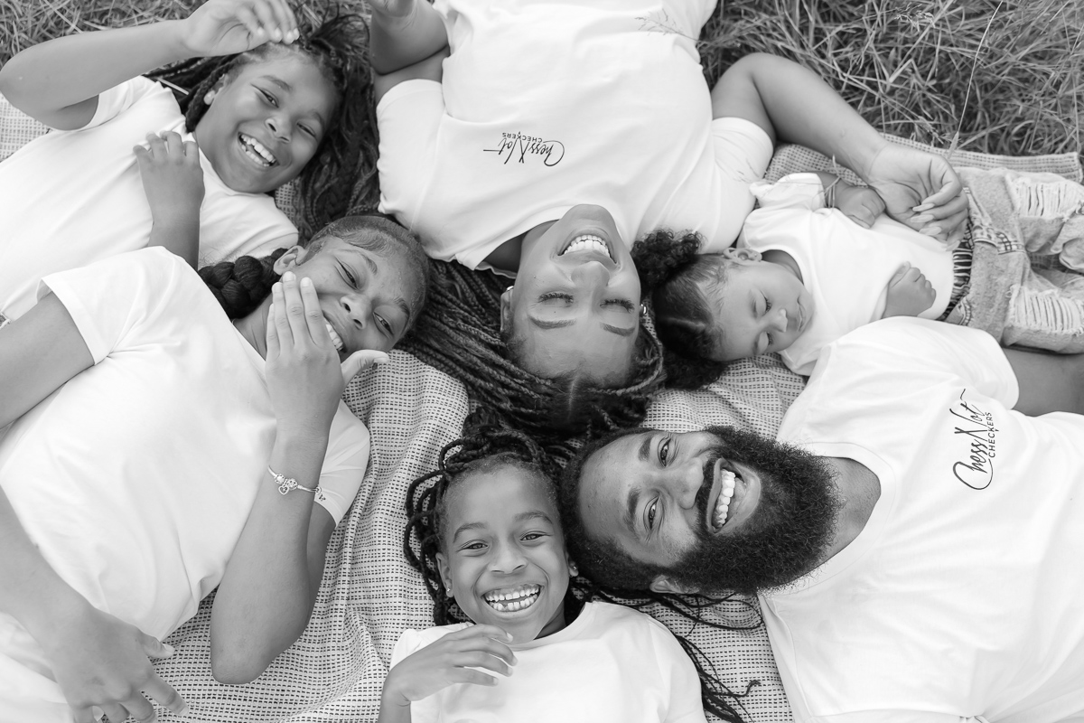 Family smiling together in london park