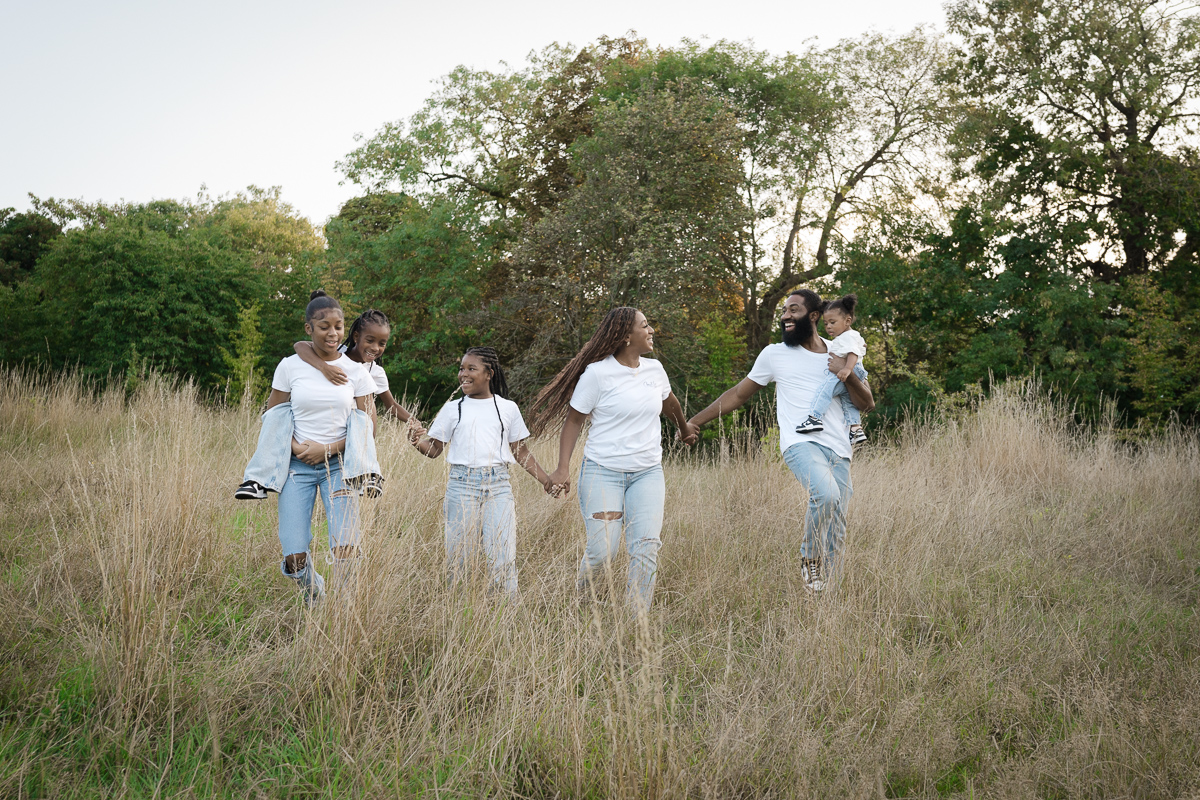 Family running together in london park