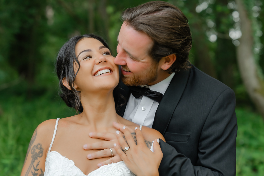 Groom kisses his bride at a portrait session Warren Estate