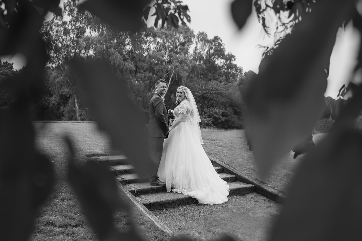 Newlywed couple pose for they photo on a staircase