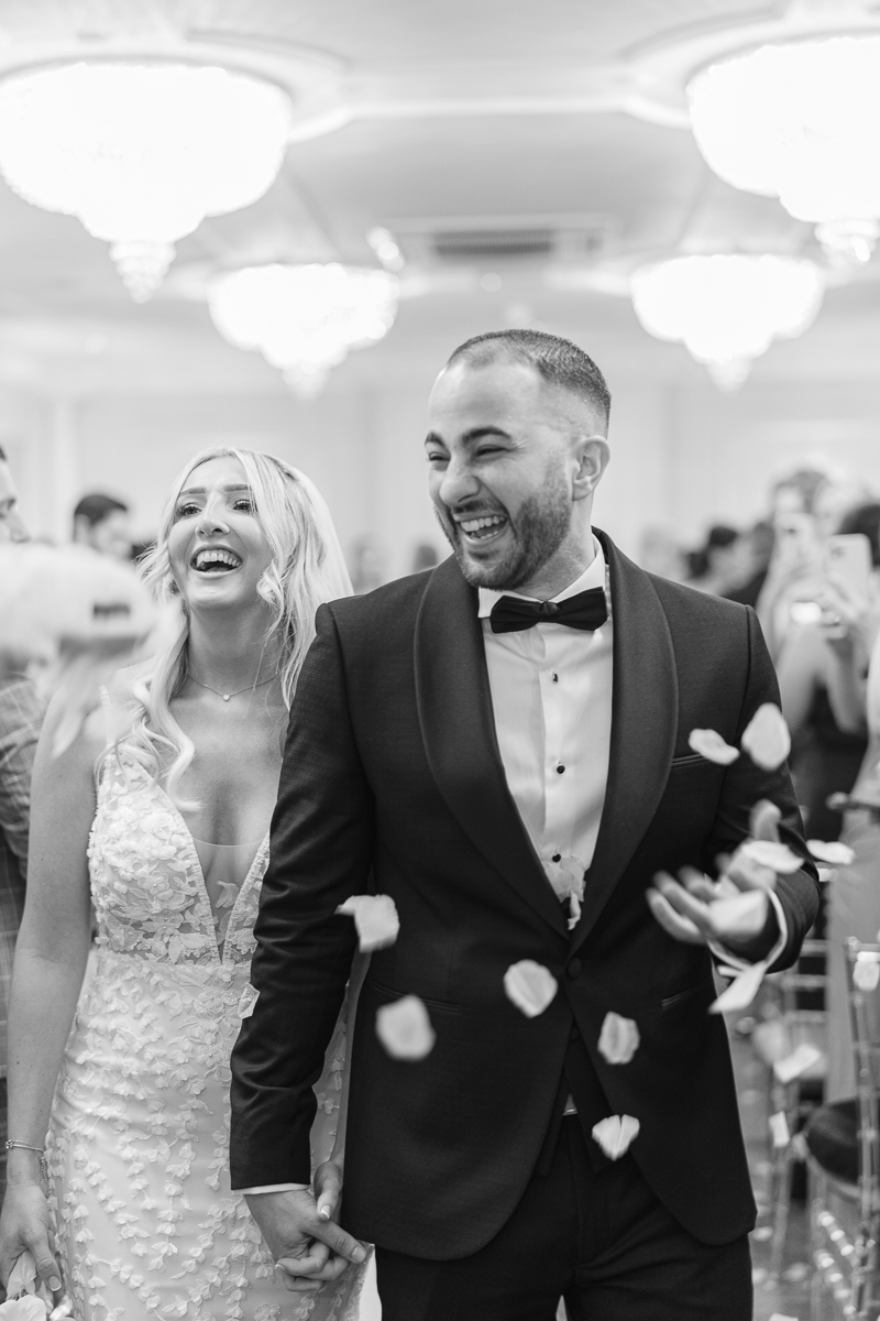 Bride and groom enjoy a confetti moment