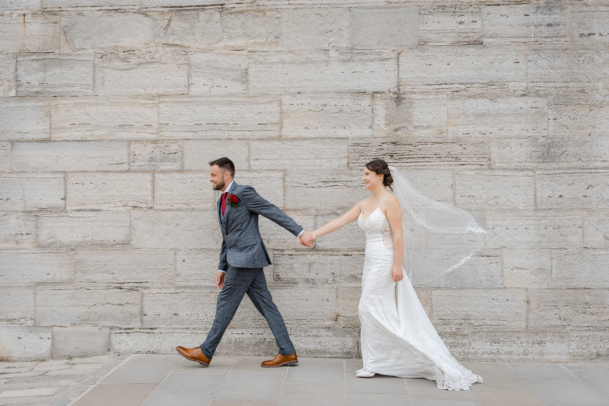 bride and groom have a laugh white taking their wedding portraits