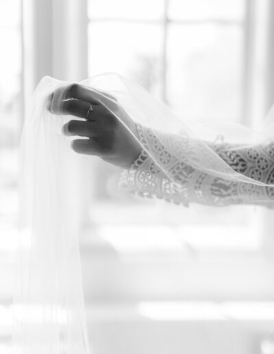 bride plays with her veil