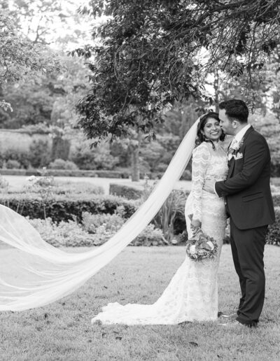 Brides veil flowing in the wind at Hanbury Manor Marriot Hotel